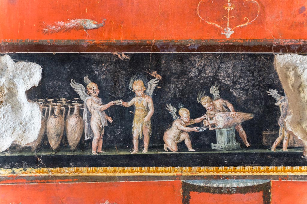 VI.15.1 Pompeii. March 2023. 
West wall at north end, with painted panel of cupids buying and selling wine. Photo courtesy of Johannes Eber.
