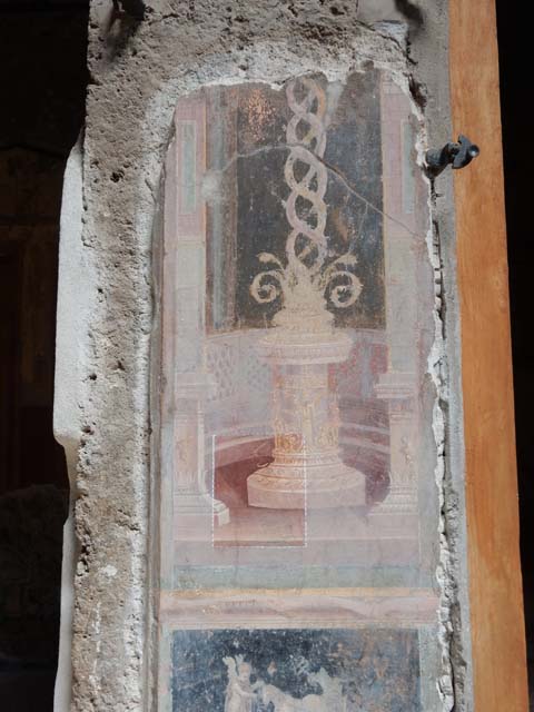 VI.15.1 Pompeii. October 2023.  
Painted panels on atrium wall between doorway to north ala, on left, and bedroom, on right.
Photo courtesy of Klaus Heese. 
