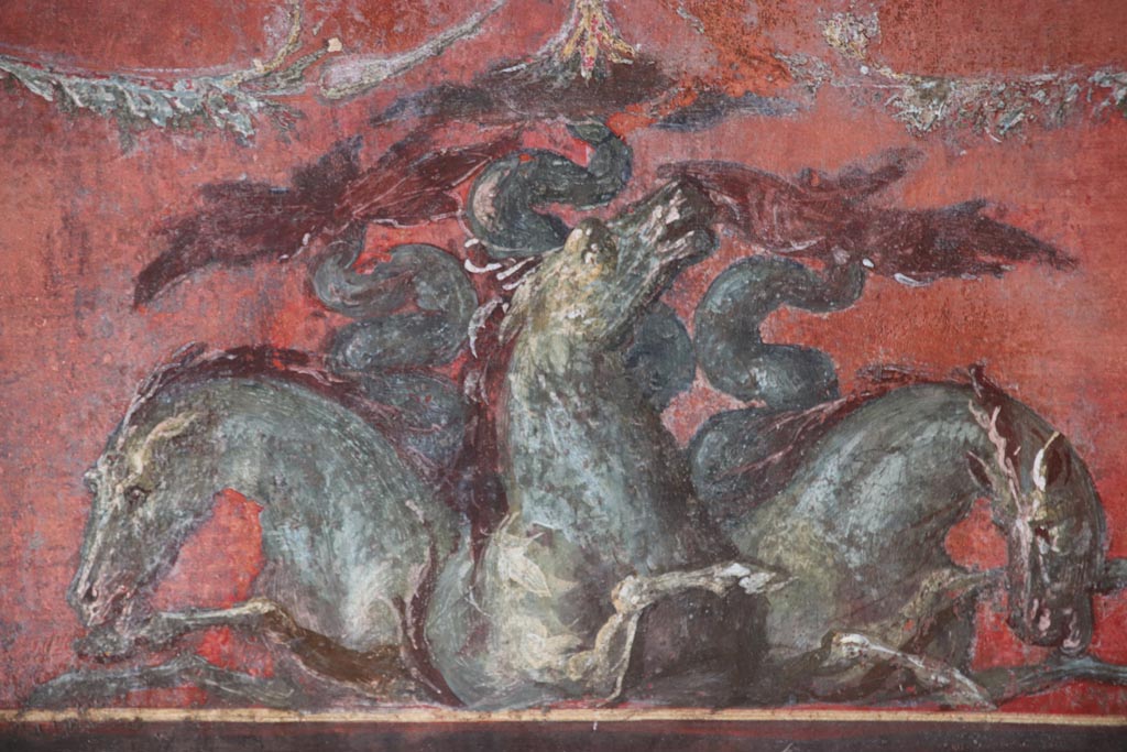 VI.15.1 Pompeii. October 2023. North wall of exedra – detail from below central painting. Photo courtesy of Klaus Heese.