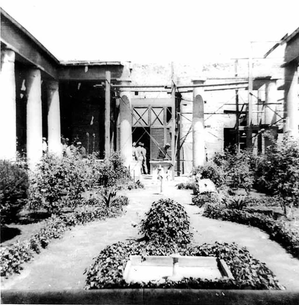 VI.15.1 Pompeii. 1944. Peristyle garden, looking north. Photo courtesy of Rick Bauer. According to Garcia y Garcia, not even the most famous house in Pompeii was saved from the 1943 bombardment. The troops of tourists that have visited there each day, are mostly ignorant of the reality of the events. On the night of 16th September 1943, a bomb fell and destroyed the north-east corner of the peristyle causing the subsidence of the floor of the peristyle. This also caused the destruction of a part of the north perimeter wall, the ruin of three columns in the peristyle, and the partial loss of the IV style painted wall from the north portico, and the west wall of the peristyle. Damage was also suffered in the south-west part of the triclinium and the north wall of the oecus of Pasifae, to the north-east of the peristyle. The partial ruin of the south corner of the women’s gynaeceum to the north of the peristyle. In the south-east corner of this area was the triclinium decorated with the painting of Hercules and Auge on the south wall.  This was damaged in its lower parts, without the possibility of restoration.  Partially damaged was the roof of the walkways around the peristyle, and that of the oecus of Pasifae, and in the cubiculum to the north of the atrium. The other paintings in the house were saved by a miracle. See Garcia y Garcia, L., 2006. Danni di guerra a Pompei. Rome: L’Erma di Bretschneider. (p.93-96, including photos)
