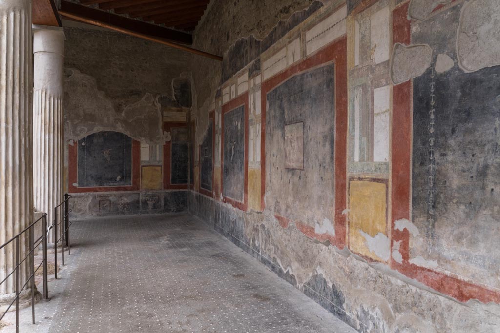 VI.15.1 Pompeii. March 2023. Looking south along west wall of portico towards south-west corner. Photo courtesy of Johannes Eber.