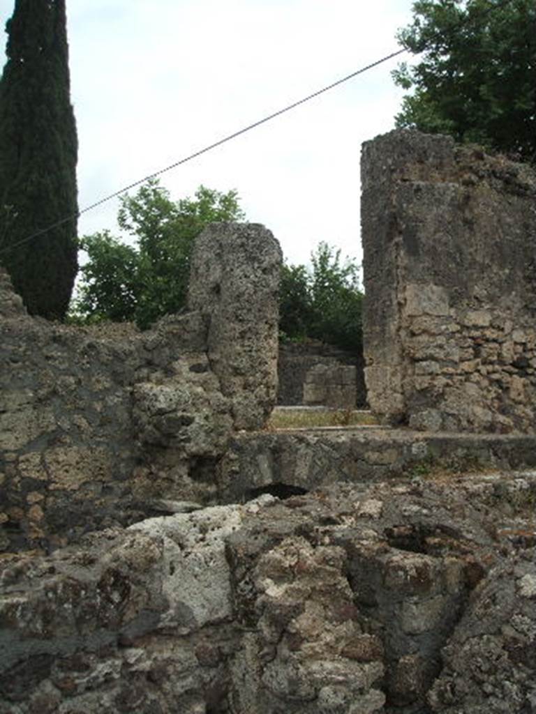 VI.17.16 Pompeii. May 2005. Site of kitchen, with cellars below? At the rear, above, would be the doorway into the atrium of VI.17.17.
