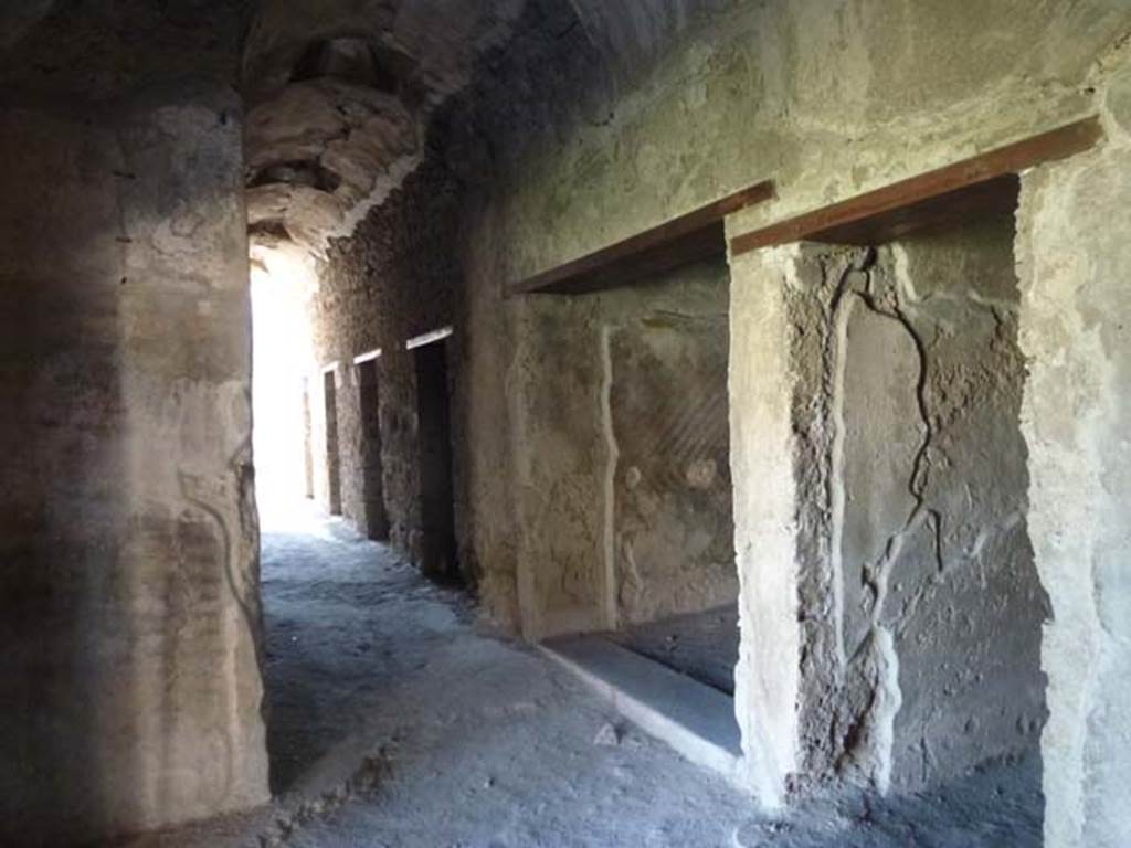 VII.1.8 Pompeii. June 2012. Corridor J leading to VII.1.50. Cella P is the first doorway, followed by latrine O and the four private baths N. Photo courtesy of Michael Binns.