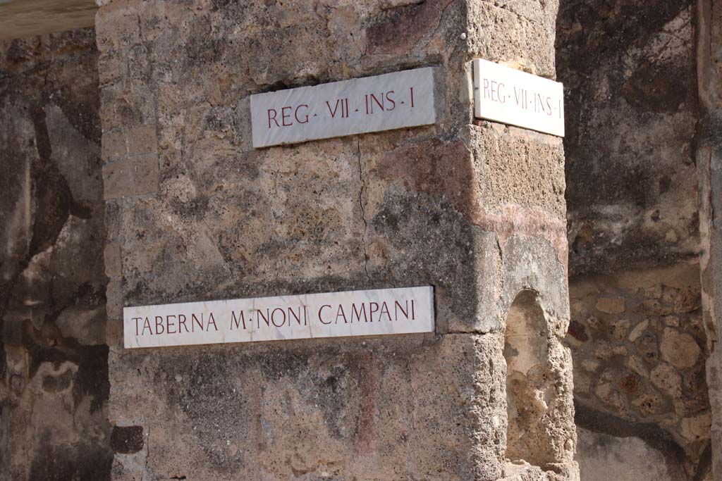 VII.1.41 Pompeii. September 2017. Looking south to pilaster at west end with identification plaques.
On the right is the second doorway at VII.1.42. Photo courtesy of Klaus Heese.
