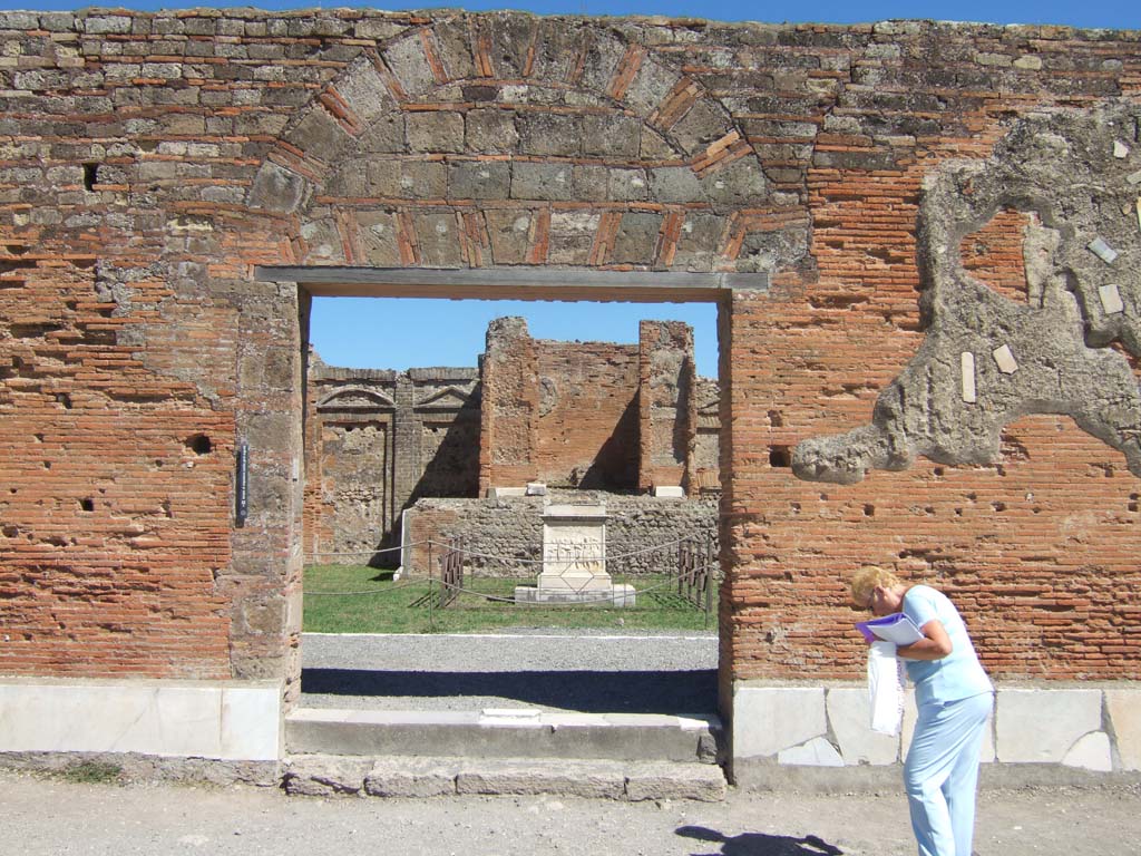 VII.9.2 Pompeii. September 2005. Entrance on east side of Forum.
According to Mau, at the time of the eruption in 79AD the entrance from the Forum had received its veneer of marble and was in a finished state.
See Mau, A., 1907, translated by Kelsey F. W. Pompeii: Its Life and Art. New York: Macmillan. (Page 109).
