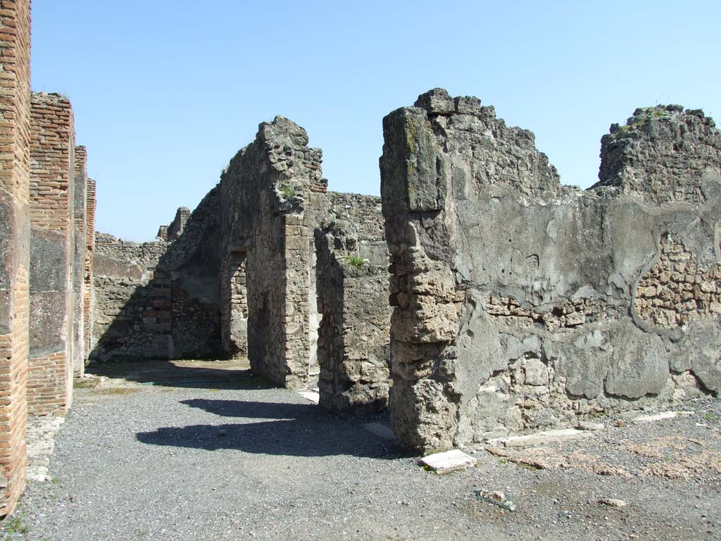 VII.14.9 Pompeii. March 2009. Looking east across south portico, to rooms 11, 12 and 13.