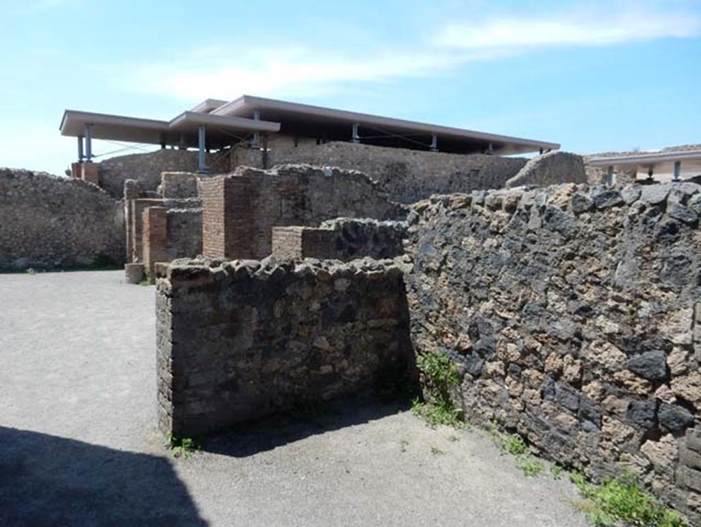 VIII.2.3 Pompeii. May 2018. Looking north-west from rear of VIII.2.5, across north portico of peristyle, at rear of tablinum. 
Photo courtesy of Buzz Ferebee.
