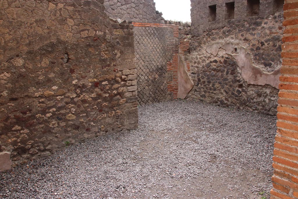 VIII.2.16 Pompeii. May 2024.
Looking towards south-east corner of room, and opening leading in direction of entrance corridor, which would have been under the stairs to the upper floor. Photo courtesy of Klaus Heese.
