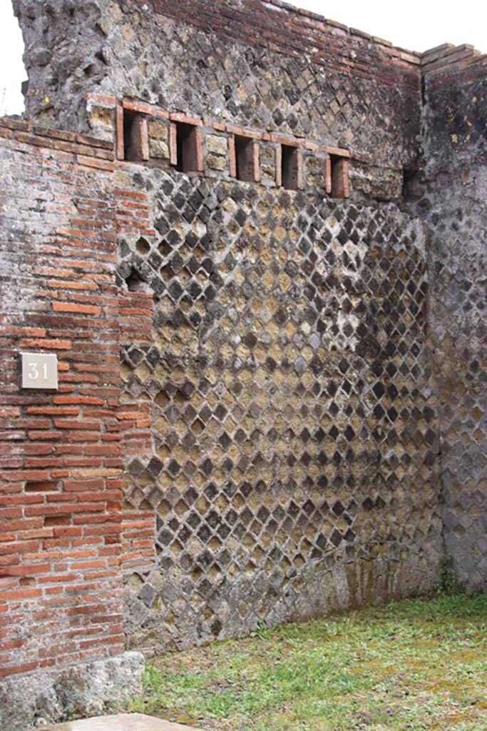 VIII.2.31 Pompeii. May 2024. East wall of shop-room. Photo courtesy of Klaus Heese.