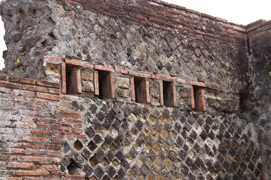 VIII.2.31 Pompeii. May 2024. Detail of east wall with holes for support beams for an upper floor. Photo courtesy of Klaus Heese.