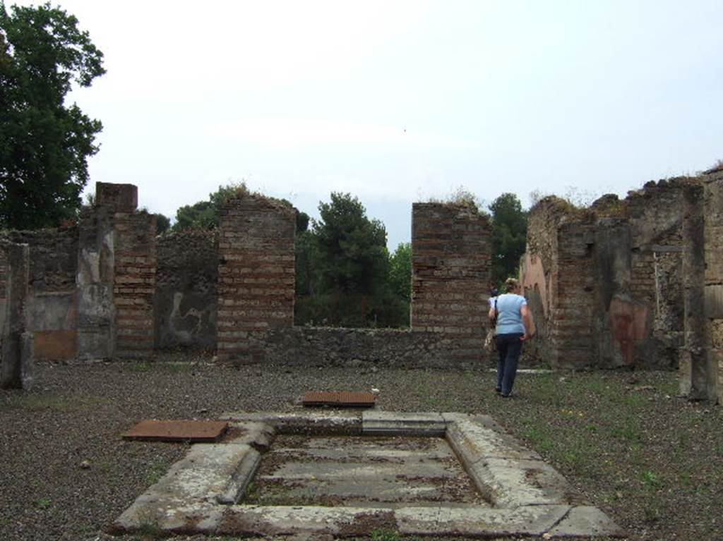 VIII.2.39 Pompeii. May 2006. Looking south across impluvium in atrium, room b.