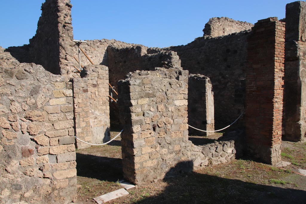 VIII.5.16 Pompeii. October 2022. 
Looking north-east towards doorway to corridor 2, and window into anteroom of room 3, from north side of portico. Photo courtesy of Klaus Heese. 
