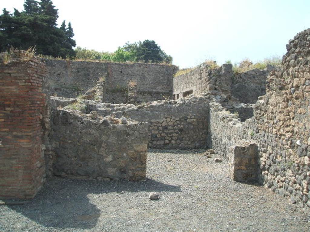 VIII.5.22 Pompeii. May 2005. Looking south across shop to rear room.