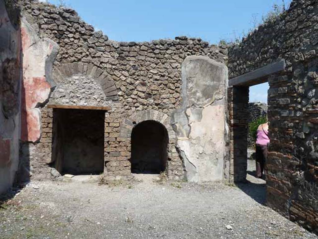 VIII.5.24 Pompeii. May 2010. Room 13, north wall with two recesses.