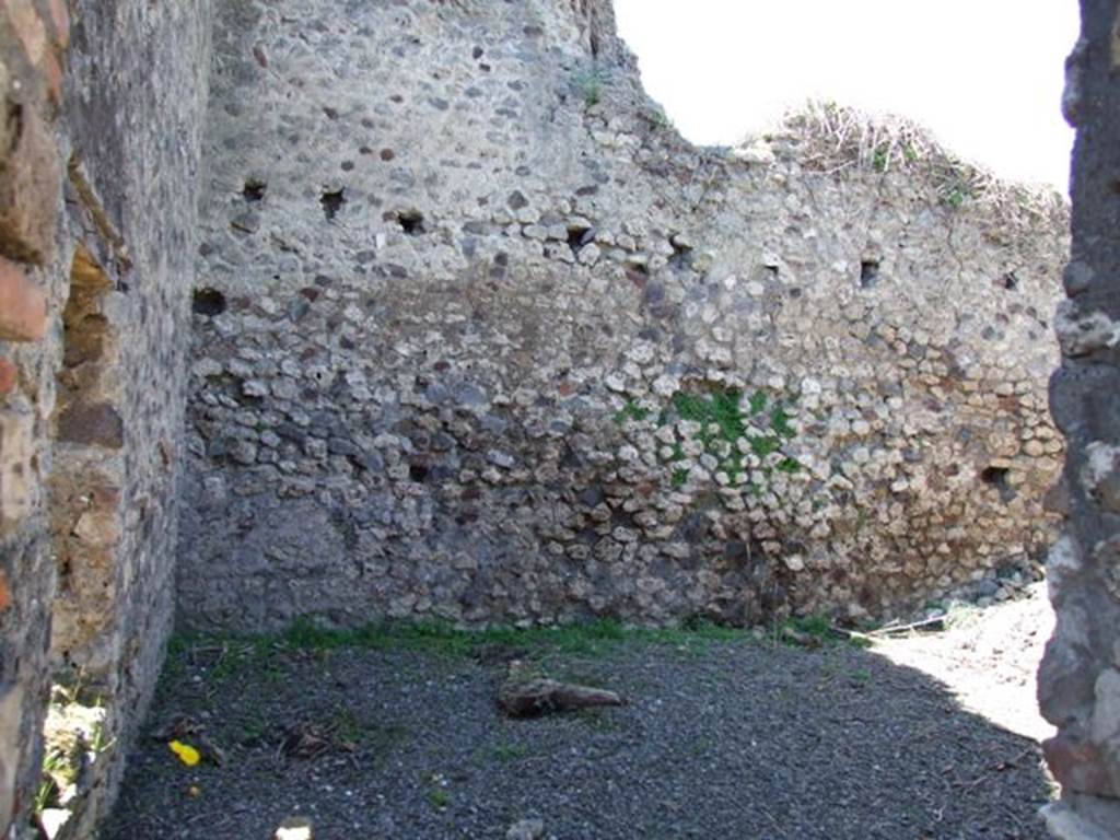 VIII.5.39 Pompeii. March 2009. Room 6, small garden area.  
South wall with window, and west wall. Looking west. According to Jashemski, this small garden area had a raised strip of soil at the base of the walls. In the middle was a pavement, serving as a passageway.
The small garden gave light to the triclinium through the window in the south wall. It also gave light to a room in a neighbours house on the west (VIII.5.2). See Jashemski, W. F., 1993. The Gardens of Pompeii, Volume II: Appendices. New York: Caratzas. (p.218)
