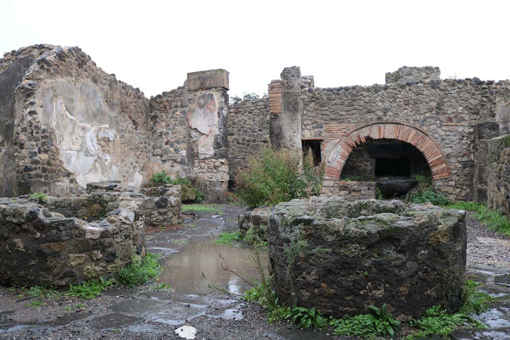 VIII.6.11, Pompeii. December 2018. 
Looking north-east across bakery room, with room “k”, on extreme left, and room “e”, in centre. Photo courtesy of Aude Durand.
