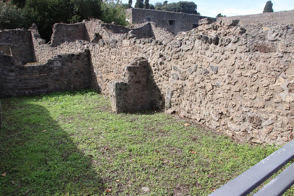 VIII.7.4 Pompeii. October 2024. Looking west along north wall of shop-room, towards rear room. Photo courtesy of Klaus Heese.