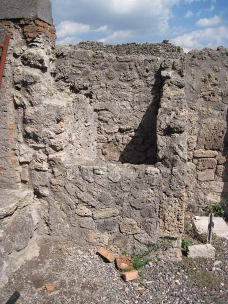 VIII.7.24 Pompeii. September 2010. Feature against east wall in north-east corner of atrium, inspection hole for Sarno canal looking east. Photo courtesy of Drew Baker.
