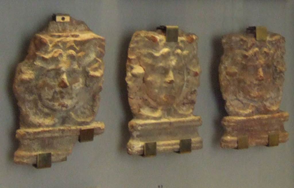 VIII.7.28 Pompeii. Roofing of the portico. Antefixes with Gorgon heads. Now in Naples Archaeological Museum. Inventory numbers 21462, 21463, 21464.