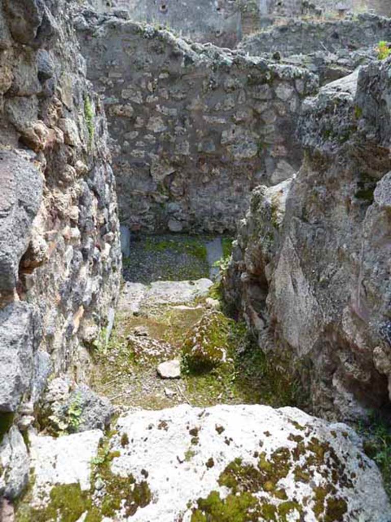 IX.1.1 Pompeii. May 2010. Looking south from IX.1.34 separate stairs to upper floor, with site of latrine under the stairs. 