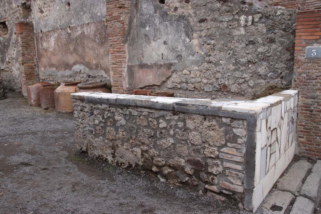 IX.1.3 Pompeii. October 2020. Looking towards south wall at rear of marble counter. Photo courtesy of Klaus Heese.