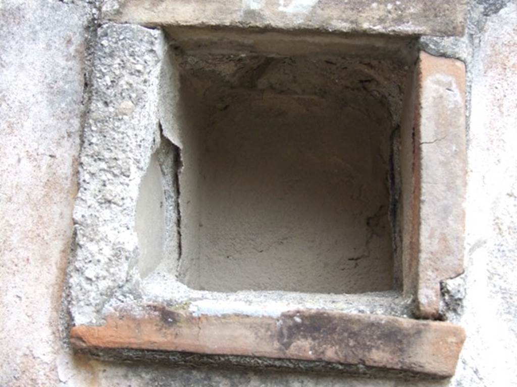 IX.1.12 Pompeii. December 2007. Niche in south wall of portico.