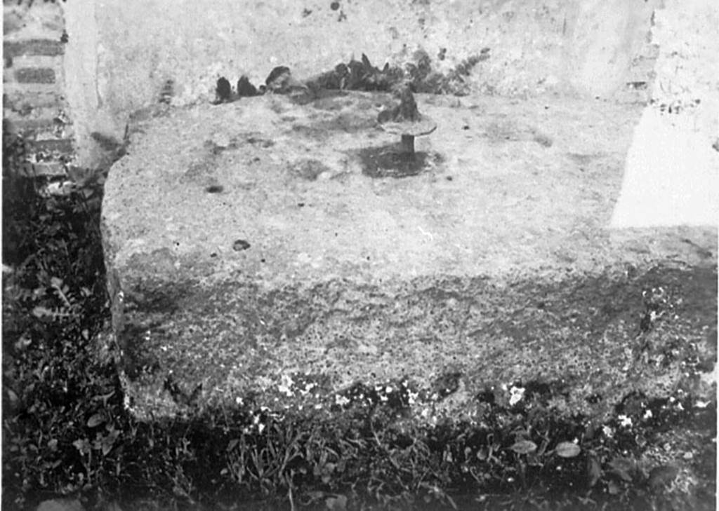 IX.2.26 Pompeii. 1932. Lava base for the arca, or money chest in the tablinum.
According to Pernice –
Found in the atrium on the back wall in front of a brick pillar that is built between a room and a passageway. 
Base made of lava. The corners are only slightly notched for right-angled feet. 
The split pin is still in the fastening pin. Under the split pin is a round disk that rested on the inside of the bottom of the chest.
See Pernice, E., 1932. Hellenistische Tische, Zisternenmündungen, Beckenuntersätze, Altäre u. Truhen. Berlin, p. 73, Taf. 43.4.
DAIR 32.1111. Photo © Deutsches Archäologisches Institut, Abteilung Rom, Arkiv. 
Thanks to Espen B. Andersson for assisting us in our interest in money-chests.

