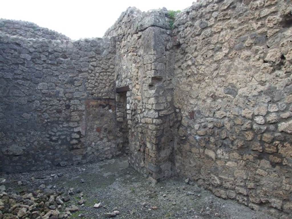 IX.3.15 Pompeii. March 2009. Room 10, looking west towards door. In the west wall is a blocked doorway that would have connected through to room 9, the cubiculum.
