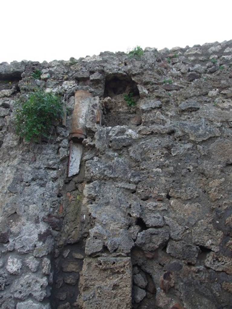 IX.3.15 Pompeii. March 2009. Room 12, north-west corner of portico, downpipe on west wall.