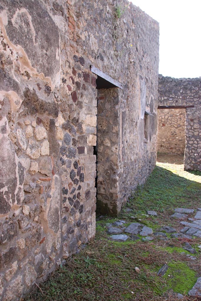 IX.3.20 Pompeii. October 2022. 
Looking west towards doorway in south wall, in centre, leading to IX.3.19. Photo courtesy of Klaus Heese. 
