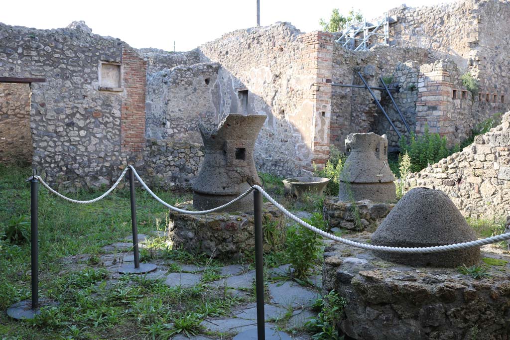 IX.3.20 Pompeii. December 2018. Room 1, mills in bakery, looking north-west. Photo courtesy of Aude Durand.