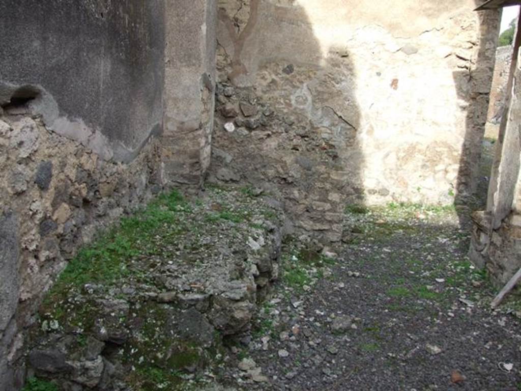  
IX.5.2 Pompeii. December 2007. Room s, looking north towards hearth or bench against west wall of kitchen.  
