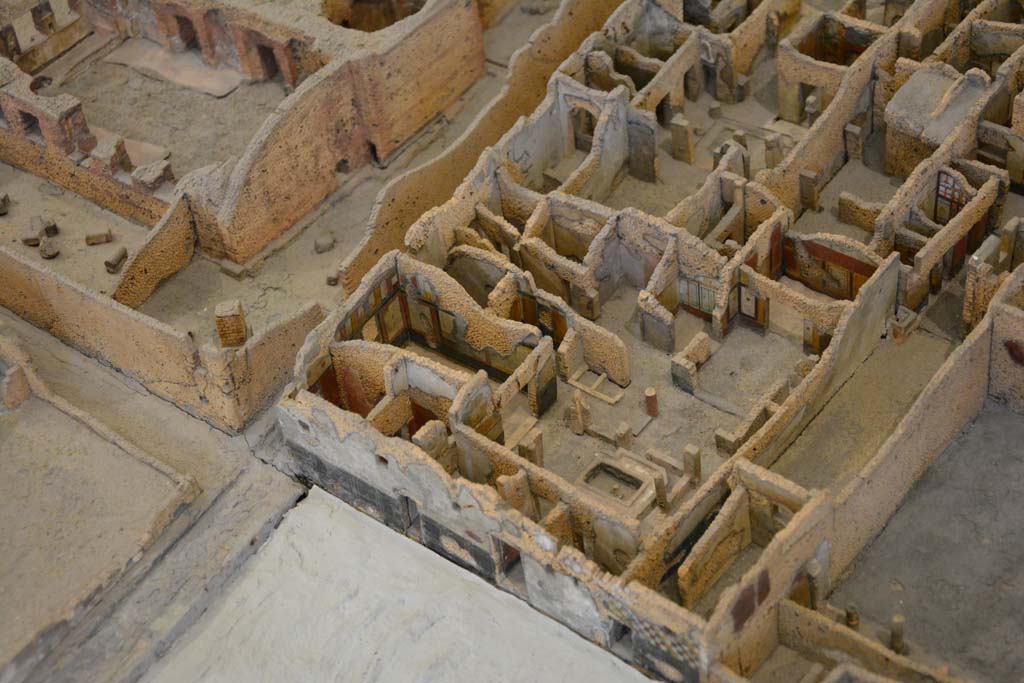 IX.5.19/18/17 Pompeii. July 2017. Looking north-west across area in south-west corner of insula.
In the upper left are areas from the Central Baths at IX.4.
From cork model in Naples Archaeological Museum.
Foto Annette Haug, ERC Grant 681269 DÉCOR
