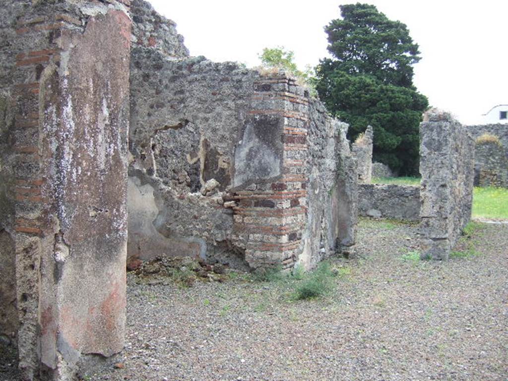 IX.9.4 Pompeii. May 2006. East side of atrium, with doorway to ala, on left.