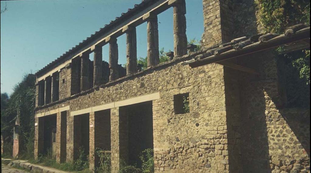 IX.12.1, IX.12.2, IX.12.3, IX.12.4, IX.12.5 Pompeii. Facade. 
Photographed 1970-79 by Günther Einhorn, picture courtesy of his son Ralf Einhorn.
