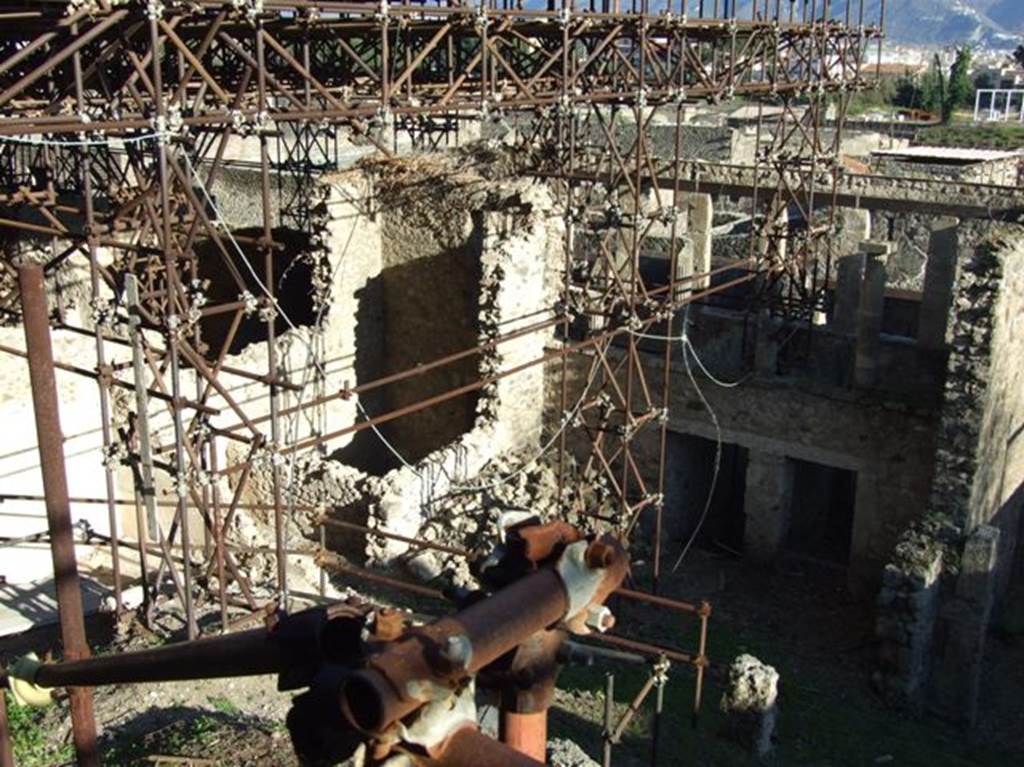 IX.12.5, IX.12.4 and IX.12.3, Pompeii.  March 2009. Showing rear view of upper  terrace, and partly excavated rooms below.