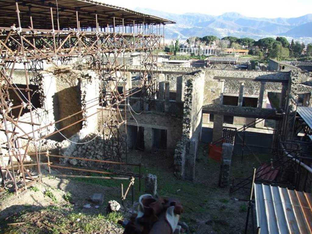 IX.12.5, IX.12.4, IX.12.3 and IX.12.2 and IX.12.1 Pompeii.  March 2009.  Looking south from rear.