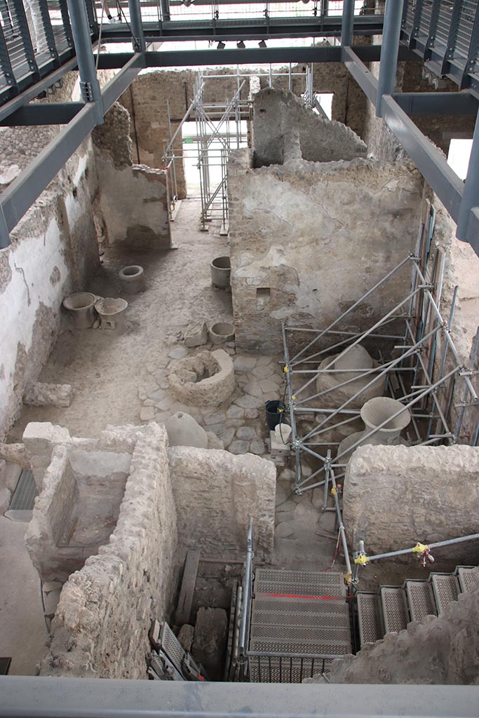 IX.12.6 Pompeii. October 2024. 
Looking south across the bakery room “e” and “f”, from room “g”. Photo courtesy of Klaus Heese.

