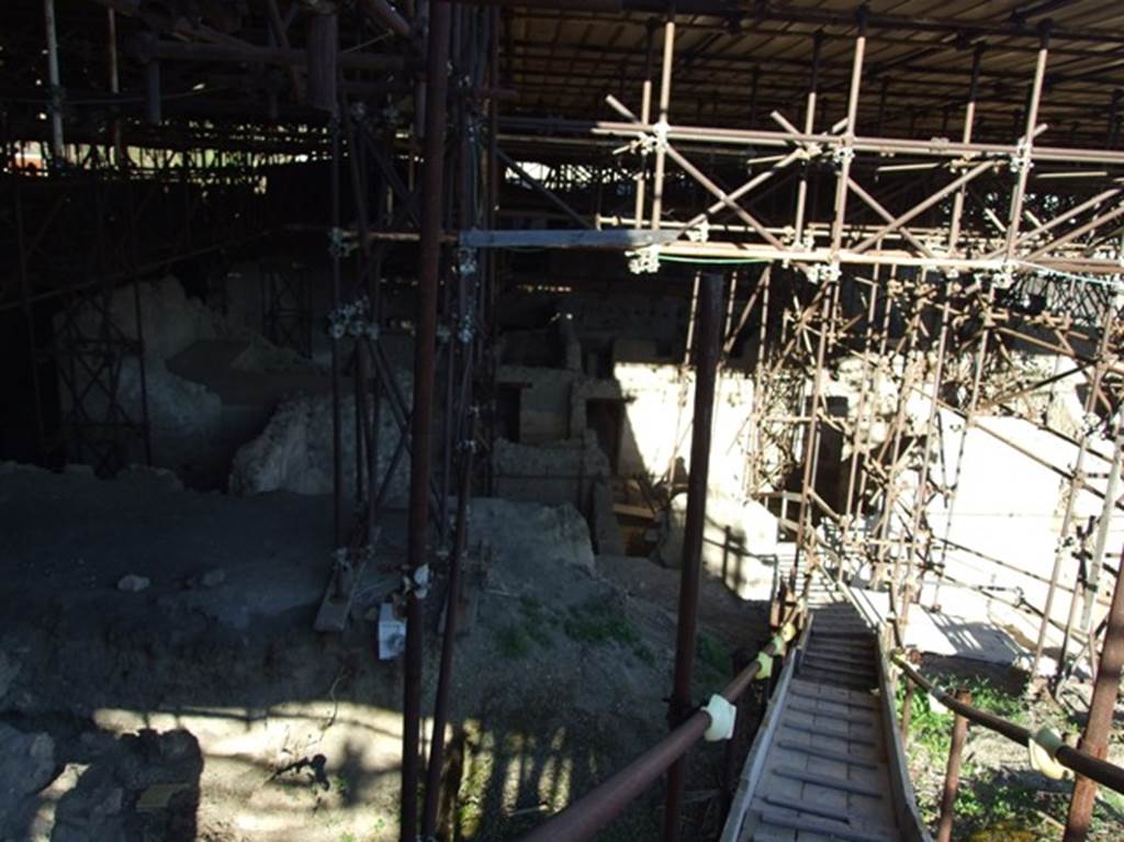 Pompeii. March 2009. IX.12. West side, partly excavated, below. Looking east towards bakery at base of steps.  