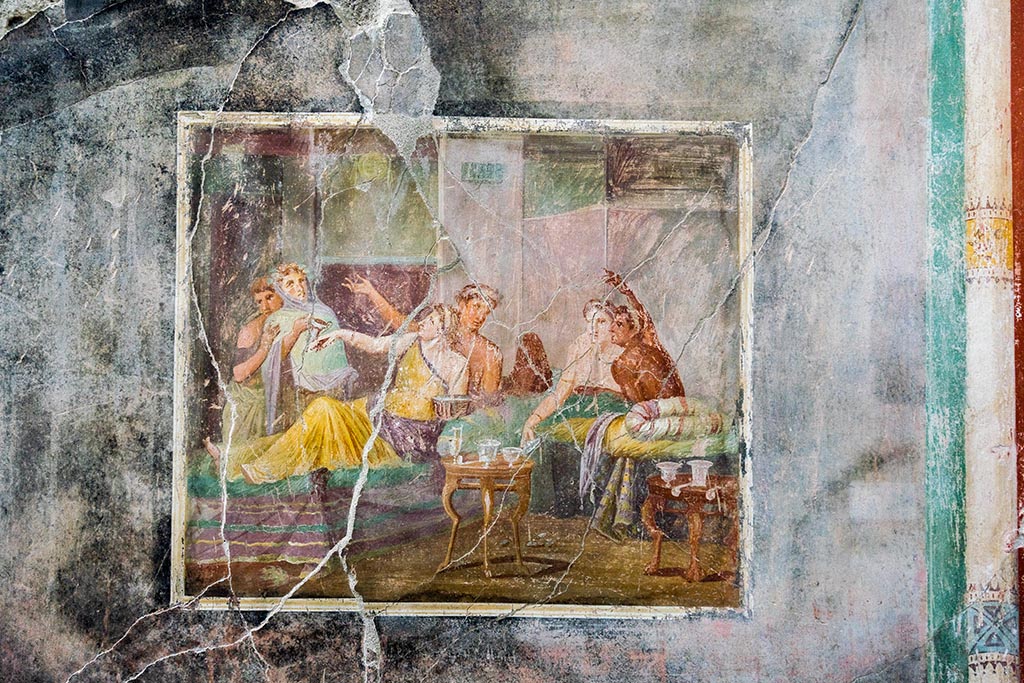 IX.12.6 Pompeii. July 2024. 
Room “m”, central painting of banqueting scene on west wall of triclinium. Photo courtesy of Johannes Eber.
