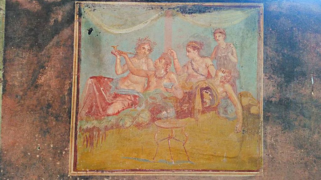 IX.12.6 Pompeii. 2016/2017. 
Room “m”, central painting from east wall of triclinium with banqueting scene. Photo courtesy of Giuseppe Ciaramella.

