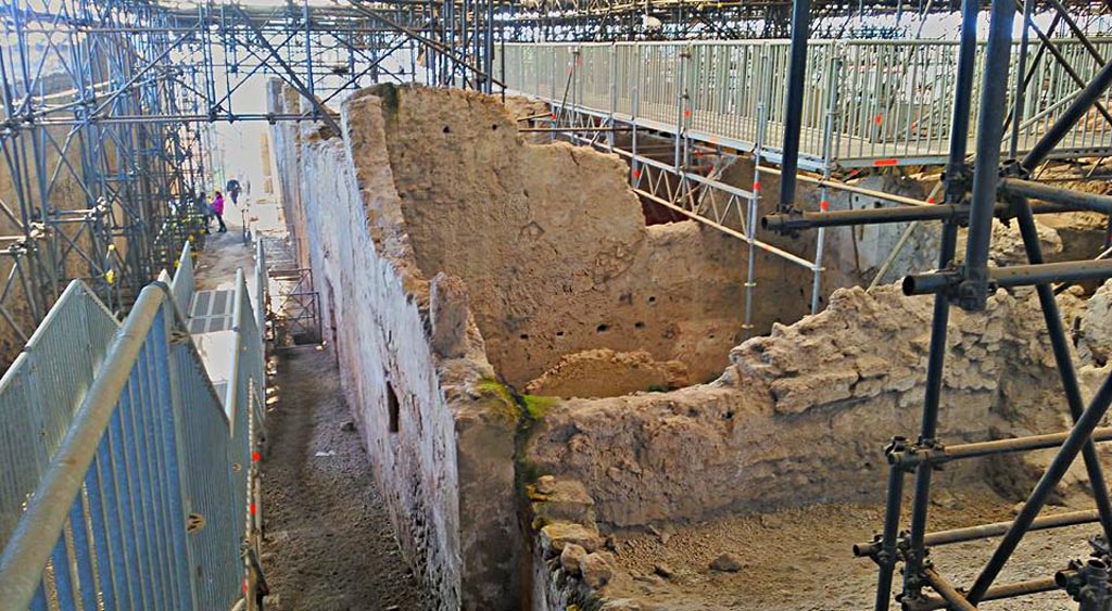 IX.12.9 Pompeii. 2016/2017. 
Looking south along roadway between IX.13 and IX.12 from excavated north-east corner of insula IX.12. 
On the right, room “a”, probably part of IX.12.B, can be seen.  Photo courtesy of Giuseppe Ciaramella.

