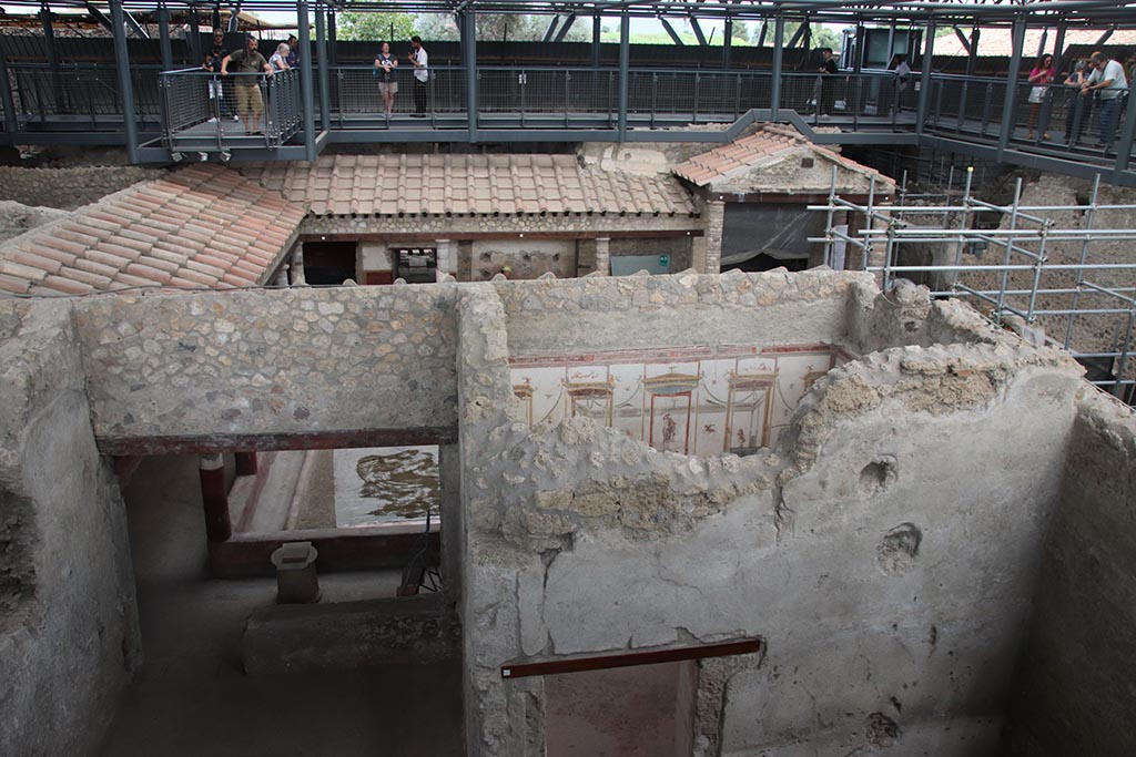 IX.12.A/IX.12.9 Pompeii. October 2024. Room 17, on left, looking east through to Peristyle 5. Photo courtesy of Klaus Heese.