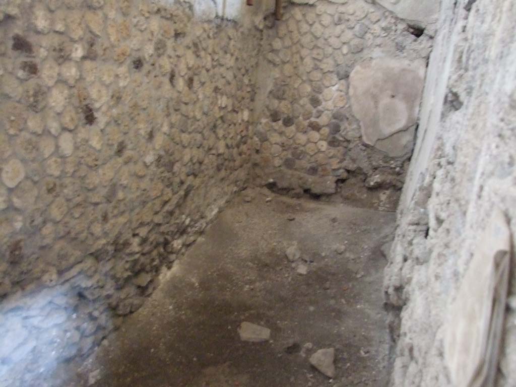 IX.12.9 Pompeii. December 2006. Room 4, kitchen. Narrow area on north side.