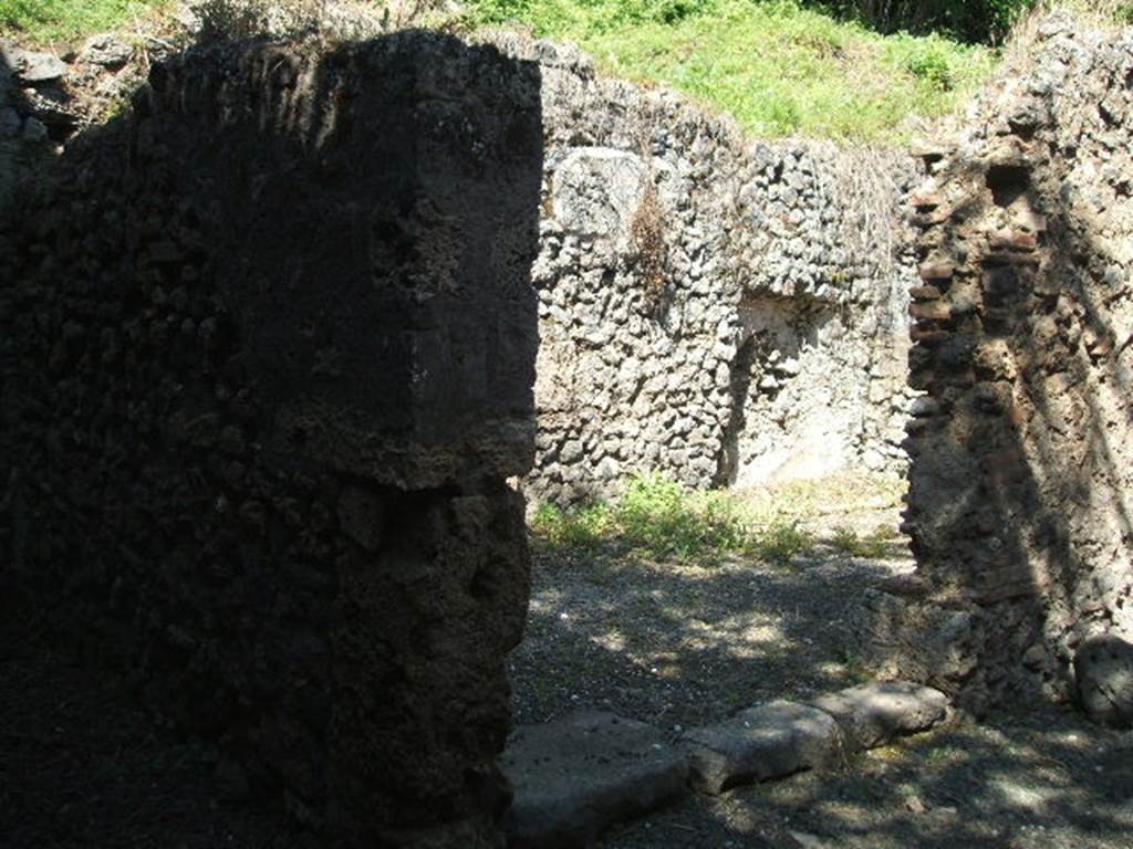 IX.14.b Pompeii. May 2005. Room in south west corner of IX.14.4. 
Doorway leading to room with entrance, now blocked. 

