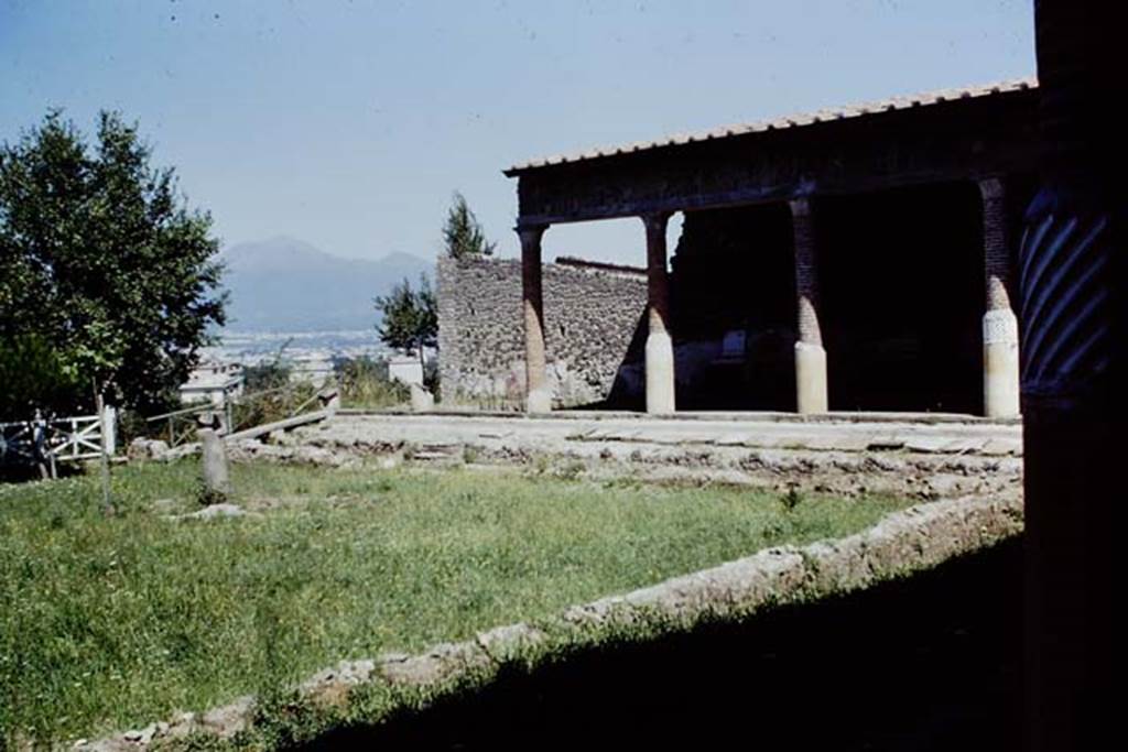 Villa San Marco, Stabiae, 1968. Area 66, garden peristyle area. Looking north towards the view to Vesuvius.  Photo by Stanley A. Jashemski.
Source: The Wilhelmina and Stanley A. Jashemski archive in the University of Maryland Library, Special Collections (See collection page) and made available under the Creative Commons Attribution-Non Commercial License v.4. See Licence and use details. J68f1909
On the right one of the standing spirally fluted columns can be seen.
