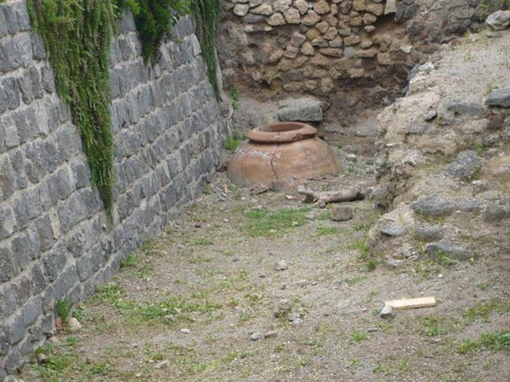 Villa of Mysteries, Pompeii. May 2012. Looking east along north side of villa towards second dolium, near the wine cellar. Photo courtesy of Buzz Ferebee.

