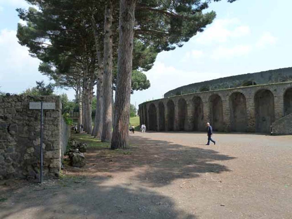 Piazzale Anfiteatro. May 2010. Looking east from southern end of Vicolo dellAnfiteatro, towards rear of II.5 and Amphitheatre.