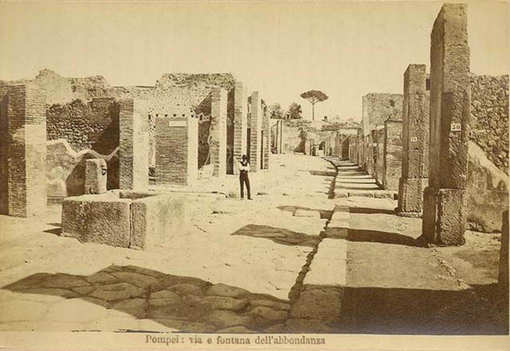 Via dell’Abbondanza. C.1880s. Looking east from near fountain at VII.14.13/14.
In the distance is the “as-yet-unexcavated” area at Holconius crossroads.
Photo courtesy of Rick Bauer.

