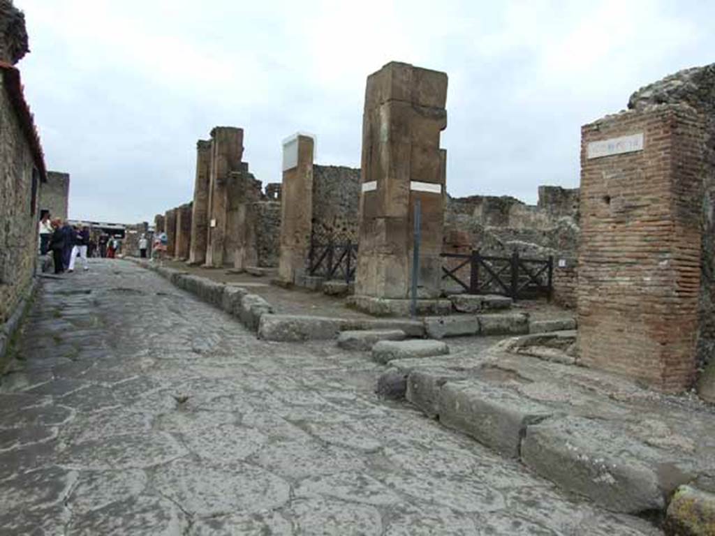 Via delle Terme, north side. May 2010. Looking west towards junction with Vicolo della Fullonica, between VI.6 and VI.8.